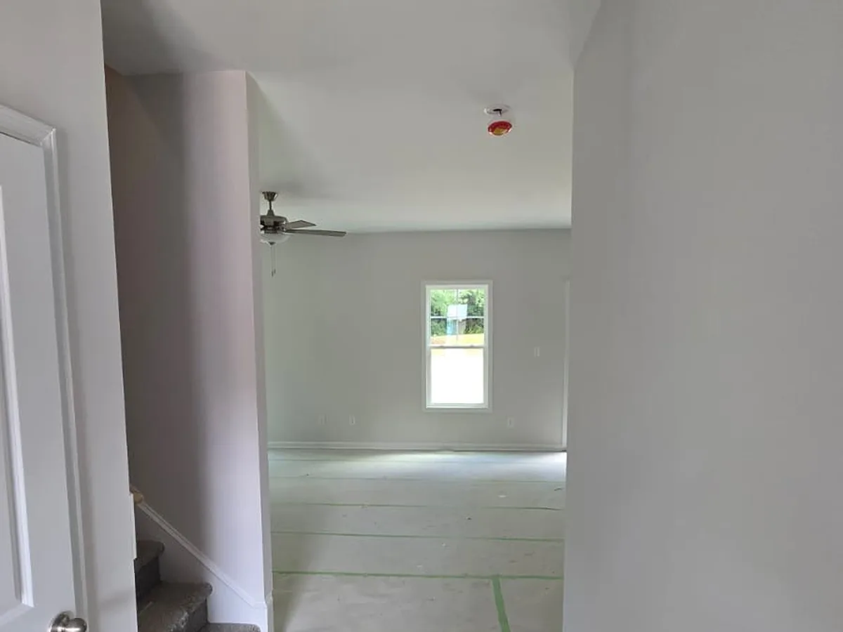 Hallway walls painted smooth leading into the living room